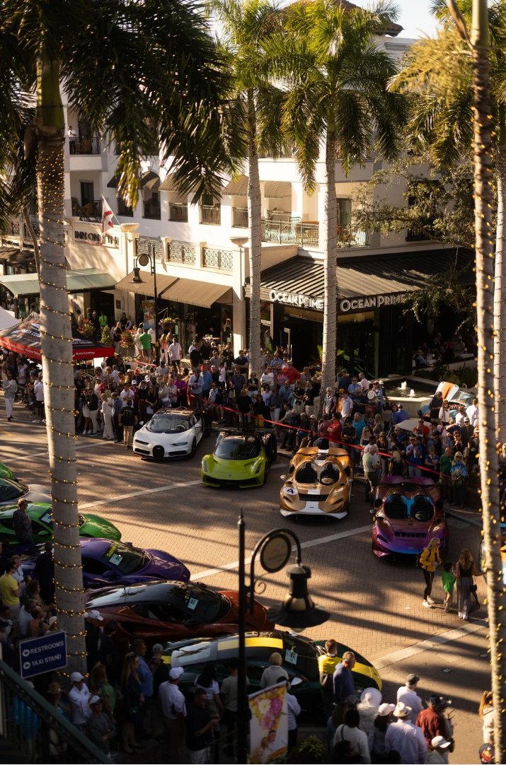 Exotic supercars lined up on 5th Avenue South at Cars on 5th in Naples